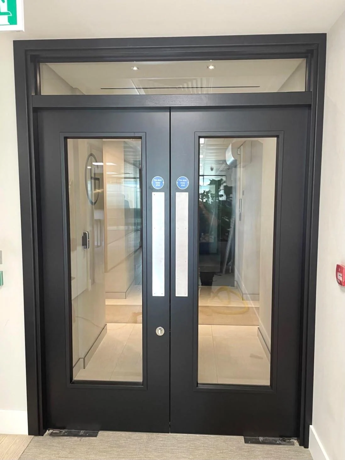 Glazed double doors installed within a building